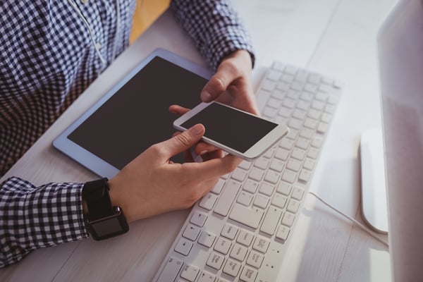 Close up view of businesswoman with technologies at her desk in office