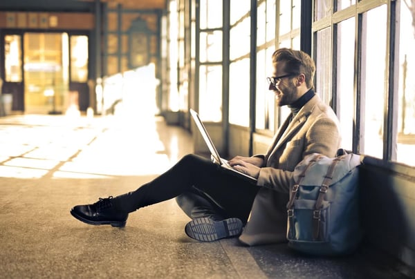 Man on computer best LMS user experience