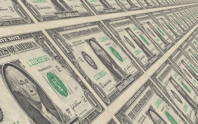 sheets of dollar bills save company money LMS.jpg