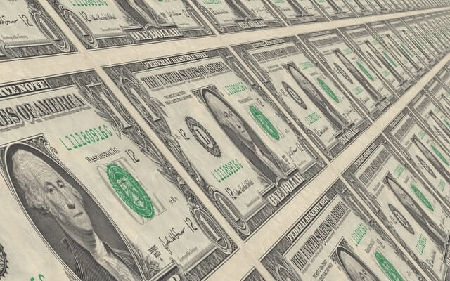 sheets of dollar bills save company money LMS.jpg