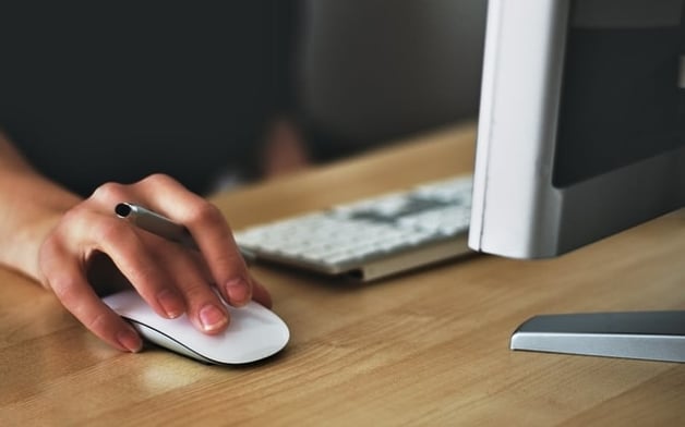 woman’s hand on computer mouse corporate eLearning course 2.jpg